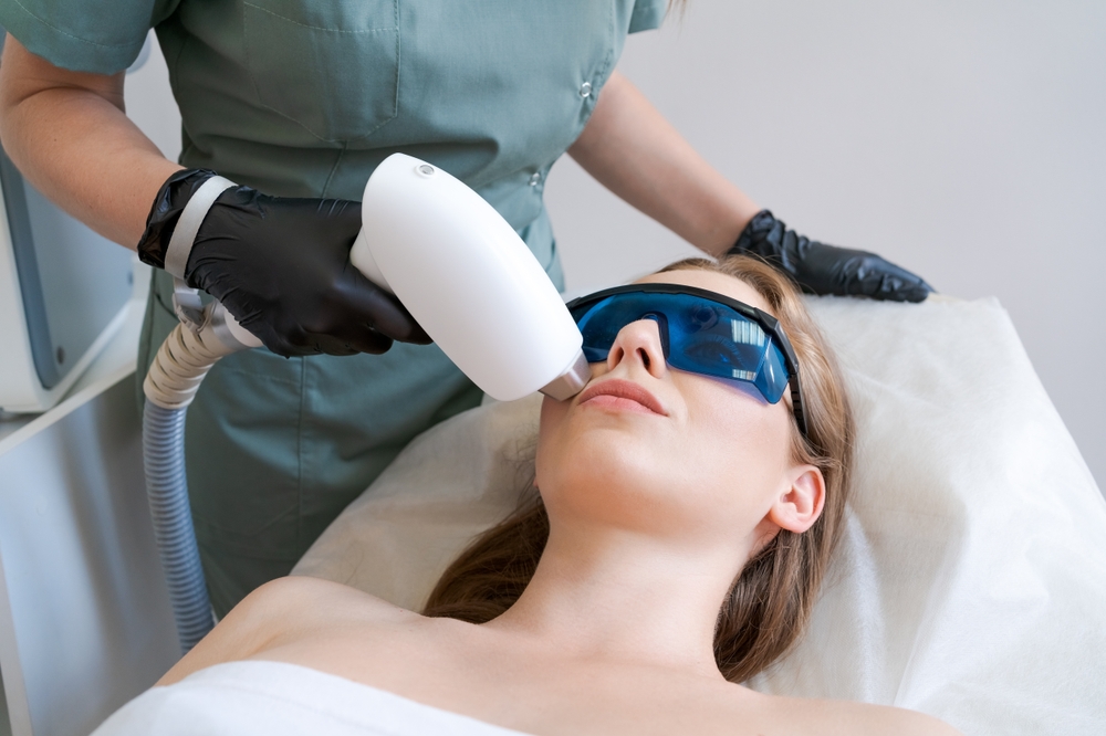 Therapist,Cosmetologist,Undergoes,Laser,Treatment,On,Face,Young,Woman,In